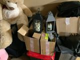 a teddy bear that is sitting next to a pile of boxes