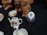 a lot of pottery items that are on a table