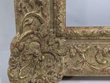 an ornate gold frame with a white background and a white background