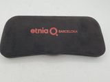 a close up of a black eyeglass case on a white surface