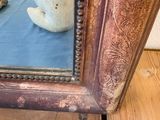 a teddy bear that is sitting in front of a mirror