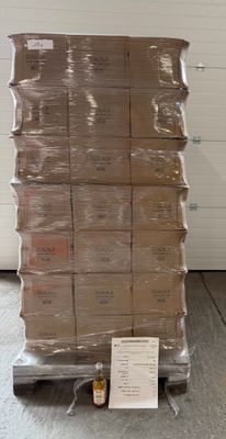 a large stack of boxes on a pallet in a warehouse