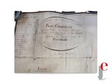 an old document with writing on it sitting on top of a table