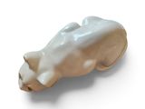 a picture of a ceramic animal head on a white surface