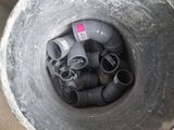 an overhead view of a large metal pipe filled with pipes