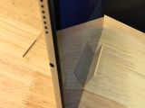 a cell phone that is sitting on a wooden table