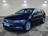 the blue volkswagen passat is parked on a checkered floor