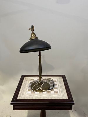 a small table with a lamp on top of it