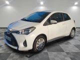 the toyota yaris is parked in a clean room with checkered flooring