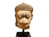 an image of a statue of a head with a crown on it ' s head
