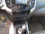 the interior of a car with a steering control and dashboard controls