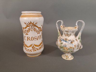 two vases sitting next to each other on a table