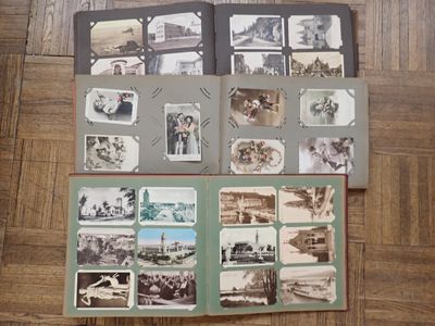 a lot of old photos that are on the floor