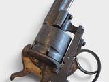 an old gun that is sitting on a table
