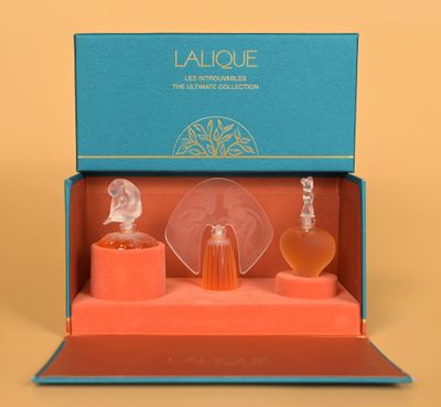 an image of a bottle of perfume in a blue box on a yellow background