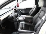 a picture of the inside of a car with black leather seats