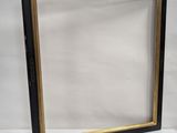 two black and gold picture frames on a white background