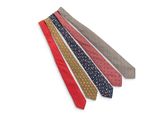 four different colored ties on a white surface with a white background