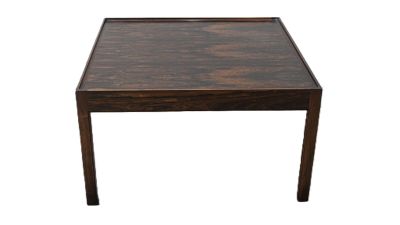 the table is made of wood and has a square top