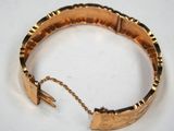 an image of a close up of a bracelet on a table