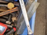 many tools and tools in a bin on the floor