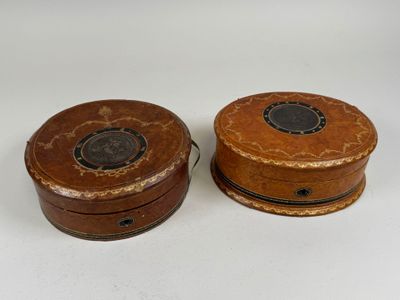 pair of antique wooden boxes with black and brown designs
