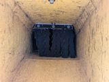 a picture of a box that has a bunch of black items in it