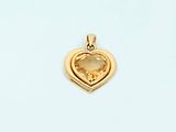 a yellow gold heart pendant with a citrine stone