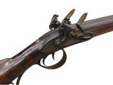 an old gun that is on display on a white background