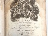 an old book with a picture of a man riding on a horse