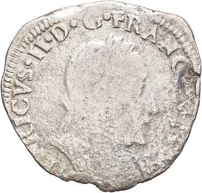 an old silver coin with the inscription of a man on it