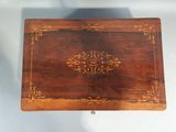 an old wooden box with a decorative design on it