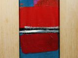 an abstract painting of red, blue, and white stripes in a wooden frame
