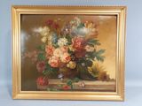 a picture of a painting of flowers in a gold frame