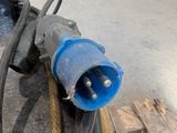 a hose attached to a piece of equipment in a warehouse