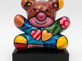 sculpture of a teddy bear sitting on top of a black base