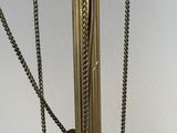 an image of a lamp with chains hanging from it ' s base