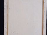 painting on a easel with a piece of paper taped to it