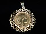 a close up of a gold coin with a woman ' s face on it