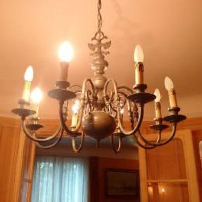 a chandelier that is hanging from the ceiling in the kitchen