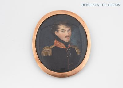 portrait of a man in a military uniform in a gold frame