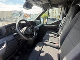a view of the inside of a truck from the driver ' s seat