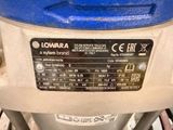 a close up of a machine with a blue top