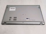 a silver laptop with a sticker on the back of it