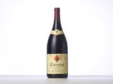 a bottle of wine sitting on top of a white table