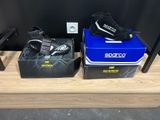 two pairs of shoes that are on display on a shelf