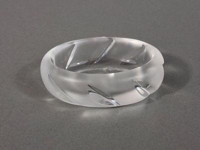 a clear ring that has a leaf design on it