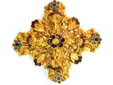 an image of a gold cross brooch with multi colored stones