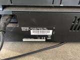 a close up of a printer with a cable connected to it