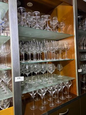 many wine glasses on the shelves in the room